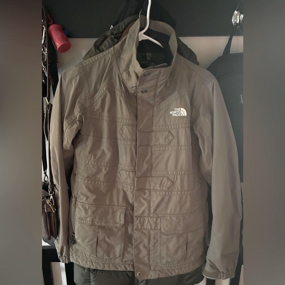 The Northface women’s jacket in olive green. Size small.